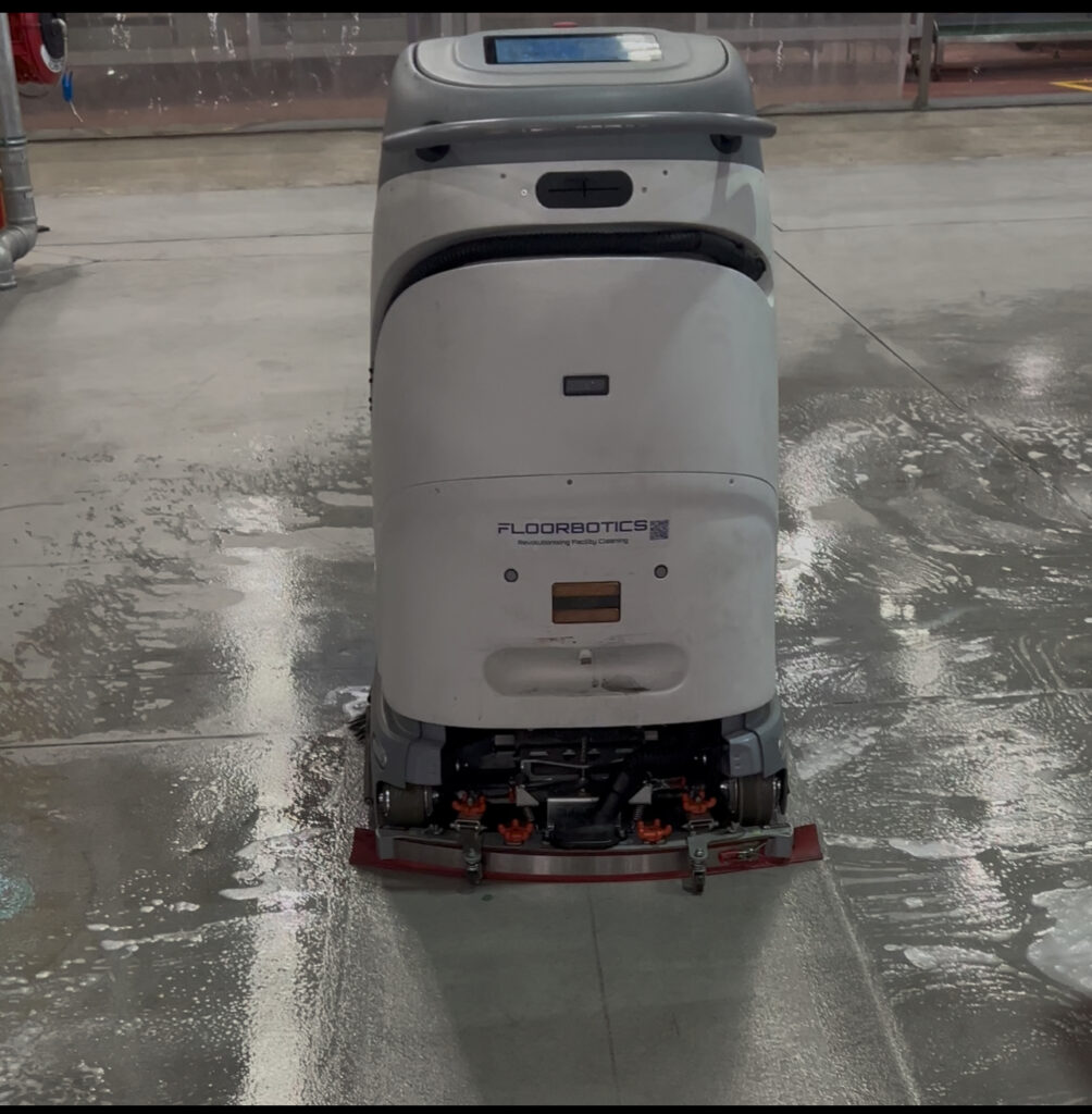 Commercial robotic floor scrubber and vacuum from FloorBotics in action — autonomous cleaning solution for warehouses, hospitals, and industrial sites, distributed by Commercial Cleaning Machines Brisbane & Sunshine Coast.