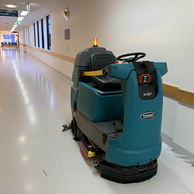 Tennant T7AMR robotic floor scrubber cleaning a hospital corridor