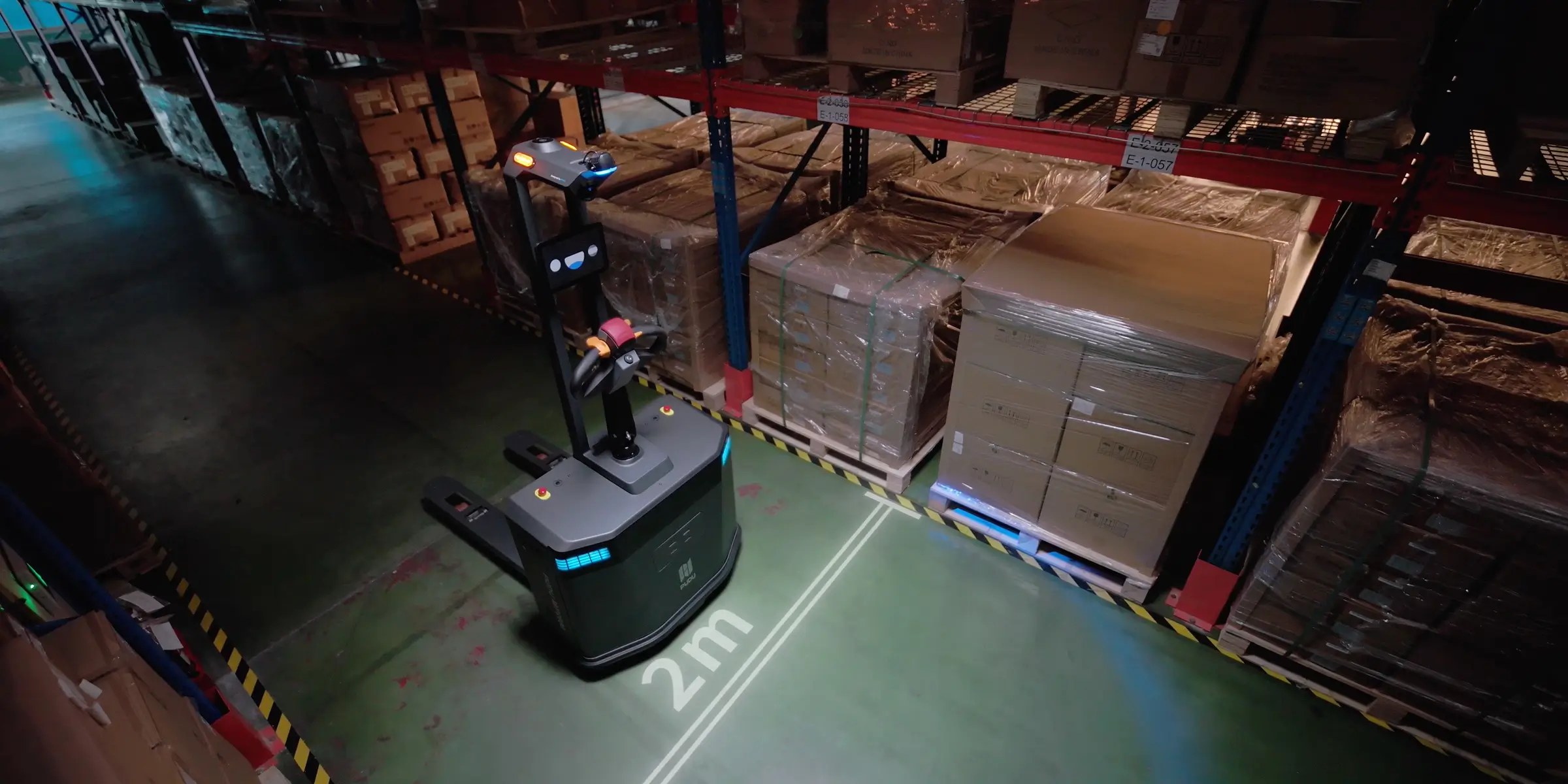 PUDU mp2000 operating midnight in the warehouse